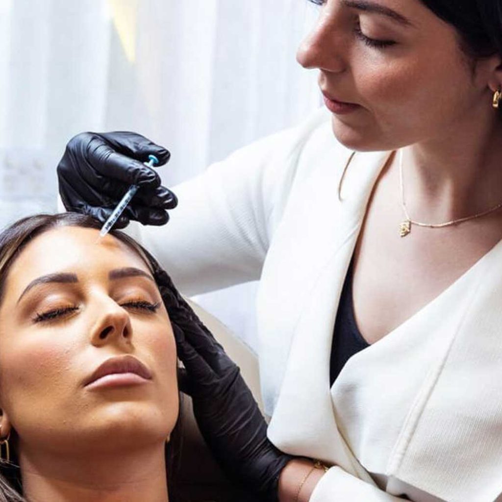 Woman receiving a cosmetic injectable treatment